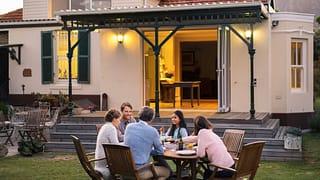 family eating at backyard table XzvkkVn.width