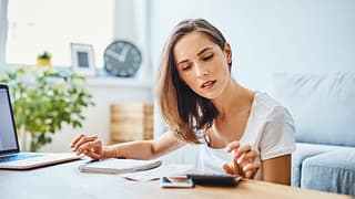 getty images woman financial planning budgeting saving money