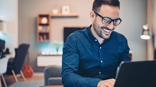man s smiling laptop gettyimages