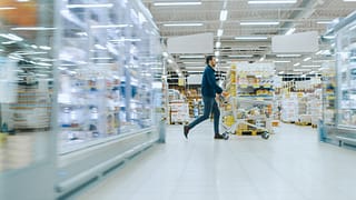 man shopping at grocery warehouse store.width .jpg