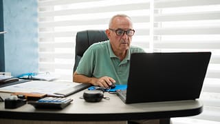 older man desk serious gettyimages
