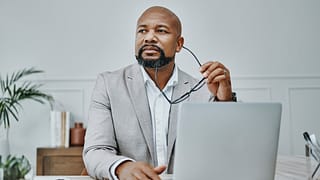 older man laptop in business suit gettyimages