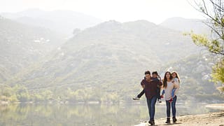 parents carrying young kids on hike hBSNf.width .jpg