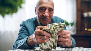 person holding one dollar bills