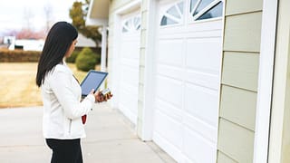 person appraising garage of home ywtXvs.width .jpg