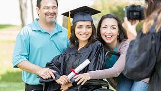 proud parents with college graduate