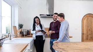 realtor showing couple new home.width