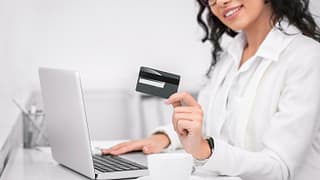 smiling woman with credit card.width .jpg
