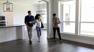 two people viewing house with realtor uSgcB.width .jpg
