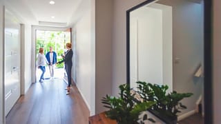 two people walking into house with realtor hd.width