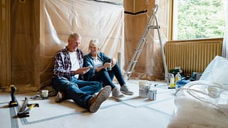 Couple sitting relaxing in a room thats under.width tylU.jpg