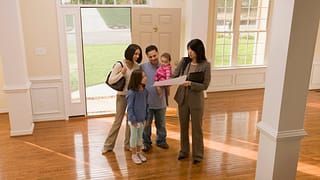 Family touring home with realtor ETEsAgi.width .jpg