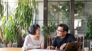 Older couple look over their investment portf.width yUHyEz.jpg
