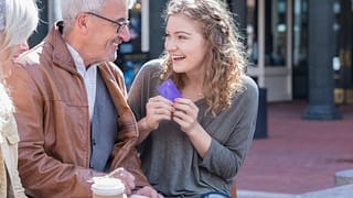 Parents giving credit card to excited teen da.width FXkOfK.jpg