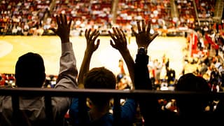 Spectators inside a basketball arena QOanBmo.width .jpg