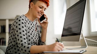 Woman working from home using computer phone .width Zsod.jpg