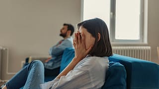 couple having an argument on couch.width .jpg