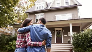 couple in front of new house.width .jpg