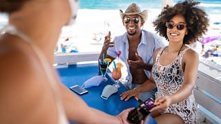 couple on vacation use contactless travel cre.width fJzORH.jpg