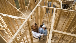 couple with architect in house under construc.width RSmacdW.jpg