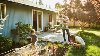family in backyard garden PRMOWmx.width .jpg