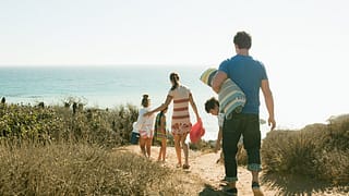family walking to beach dcUQs.width .jpg