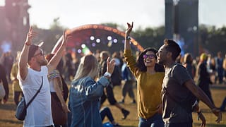 friends dancing at music festival sNvM.width .jpg