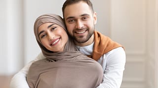getty couple smiling embracing.jpg