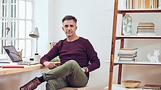 man middle aged at desk gettyimages .jpg