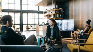 man and woman in airport lounge rQqosD.width .jpg