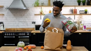 man in kitchen with groceries GPjuoM.width .jpg