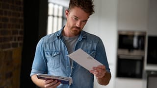 man opening mail envelopes iBuuR.width .jpg