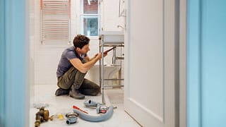 man repairing sink FHYp.width .jpg