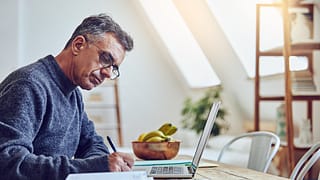 older man at laptop taking notes gettyimages .jpg