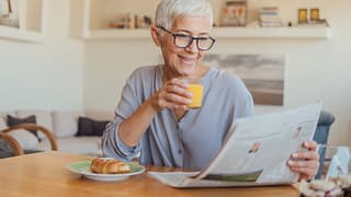 older woman newspaper gettyimages .jpg