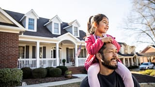 parent and child in front of house gnkEfq.width .jpg