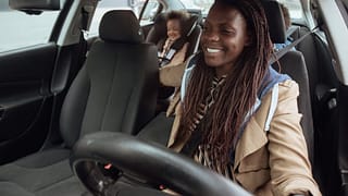 parent driving kids in car llJxxvv.width .jpg