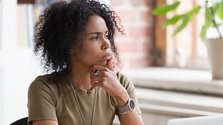 person with hand on chin thinking.jpg