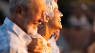 retirees sitting together laughing.jpg