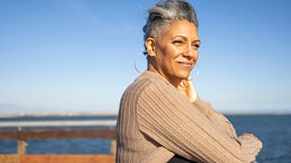 senior citizen relaxing at pier.jpg
