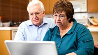 senior couple serious at laptop gettyimages .jpg