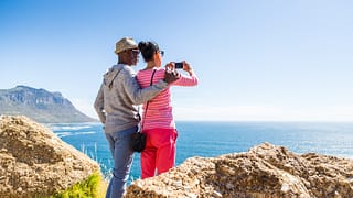 senior couple taking photo of the ocean.jpg