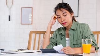 stressed woman with bills.width .jpg