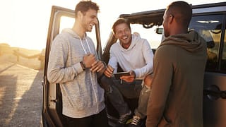 three men in car road trip.width .jpg
