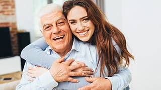 two smiling people with arms around each other gettyimages .jpg