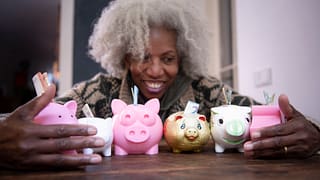 woman holding piggybanks.jpg