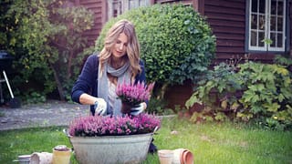 woman planting flowers enhM.width .jpg