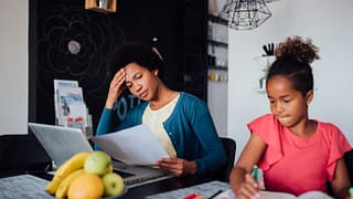 worried mom with daughter doing homework pvfm.width .jpg