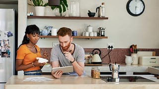 young couple in kitchen on tablet duUFRV.width .jpg