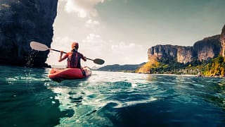 woman in kayak on ocean PZUXh.width .jpg